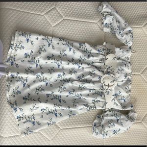 White floral dress with belt and off the shoulder sleeves